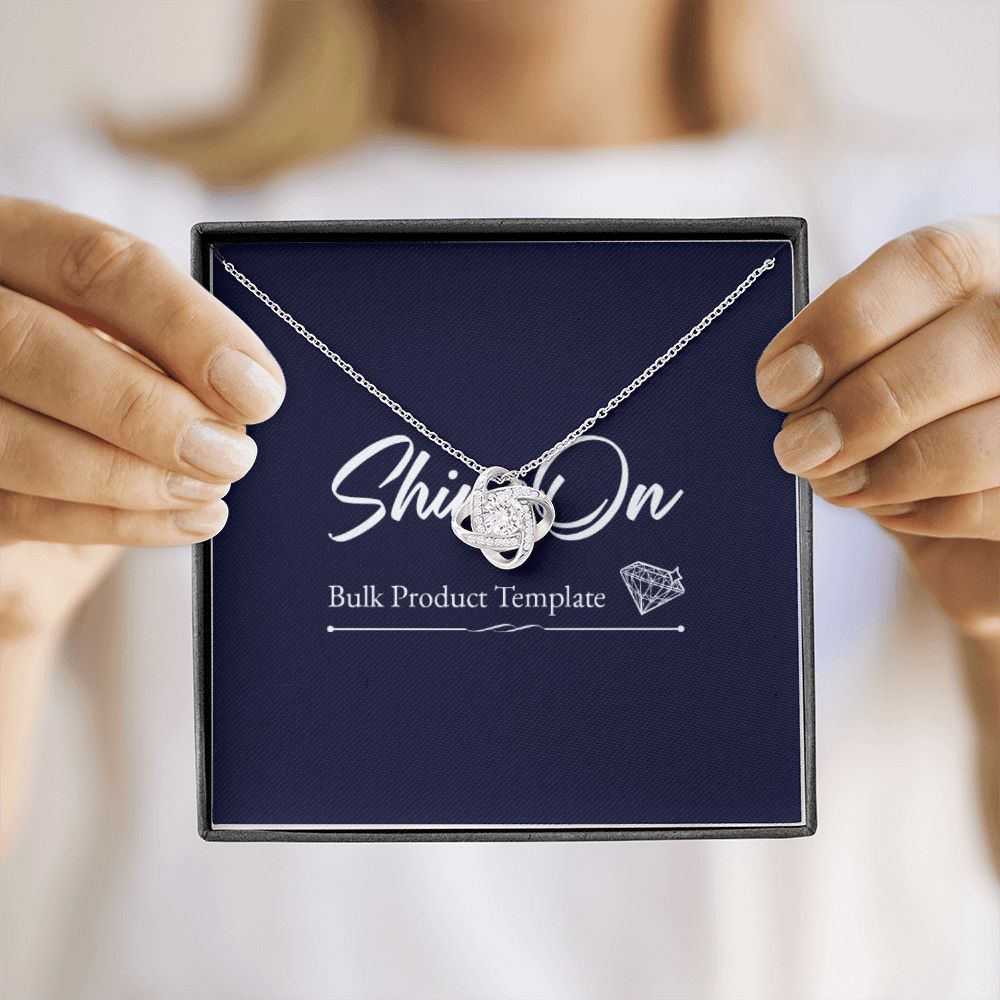 A lady 's hands hold luxury box, necklace on the message card