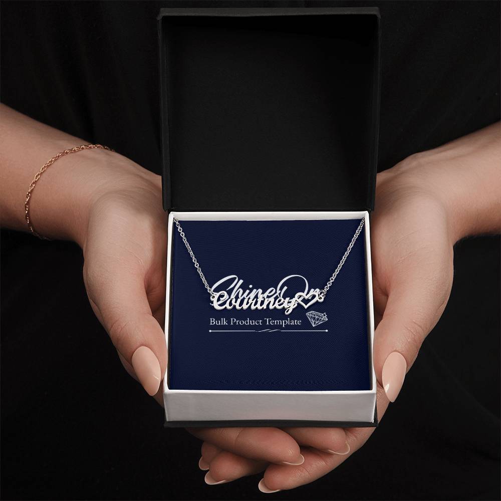 Personalised stainless steel name necklace in gift box held by hands